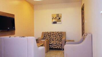 Executive Double or Twin Room | Living area | TV