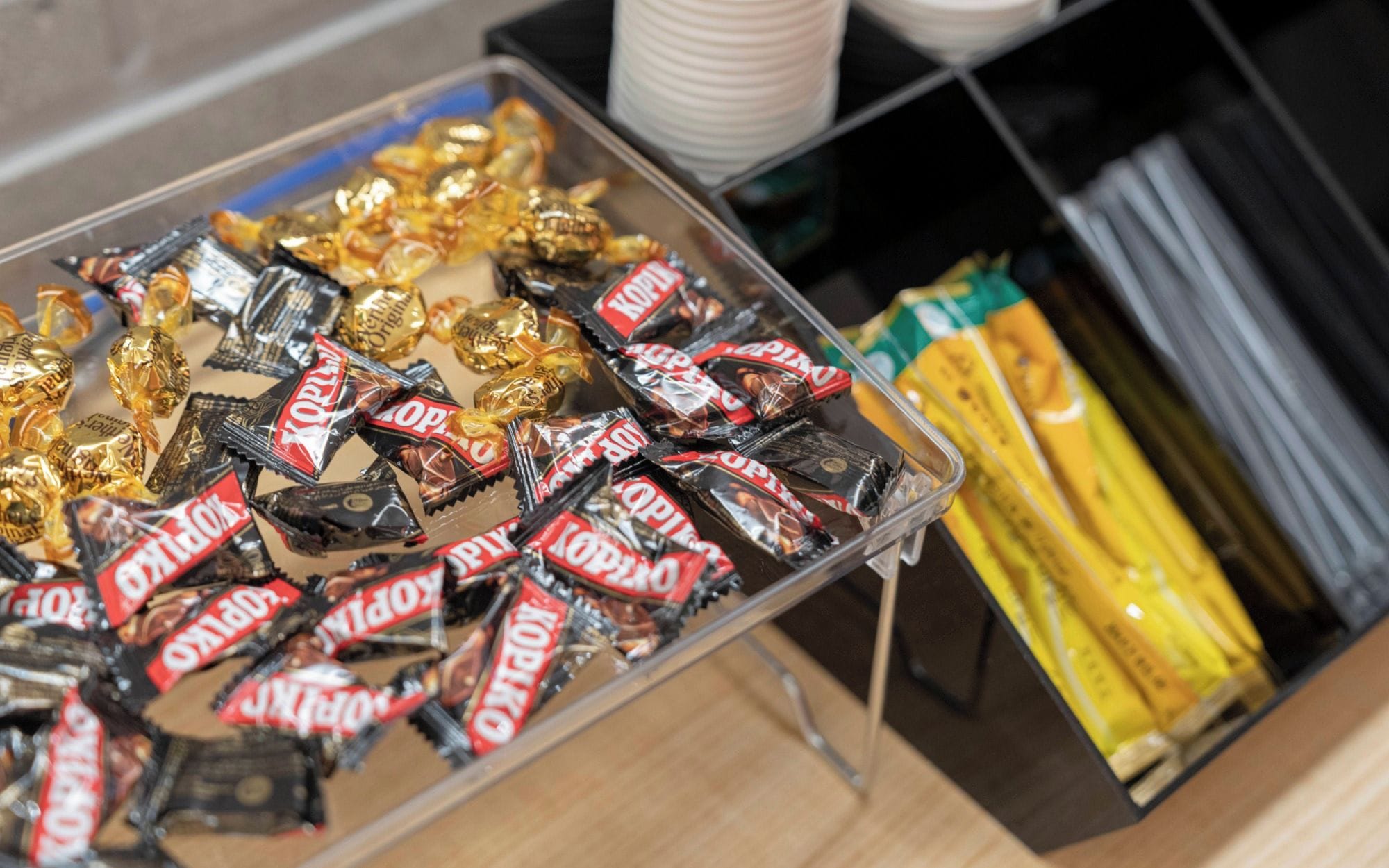 A tray of assorted chocolates and snacks.