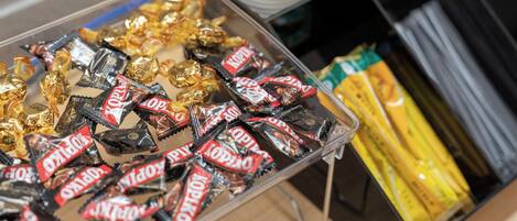 A tray of assorted chocolates and snacks.