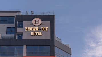 A building with a sign that reads 'BROWN-DOOT HOTEL'.