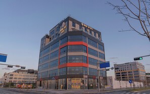 A multi-story hotel with a modern design, featuring a prominent 'BROWN DOT HOTEL' sign. - Brown Dot Geobuksum (Siheung)