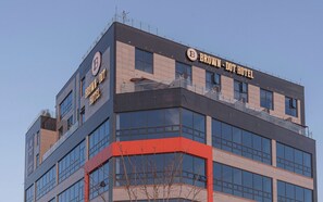 A modern hotel building with a prominent 'BROWN - DOT HOTEL' sign. - Brown Dot Geobuksum (Siheung)