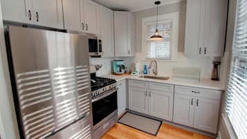 Fridge, coffee/tea maker, cookware/dishes/utensils