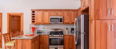 Fridge, cookware/dishes/utensils, dining tables