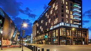 A modern hotel with a prominent sign reading "THE TRADE." - The Trade, Autograph Collection (Milwaukee)