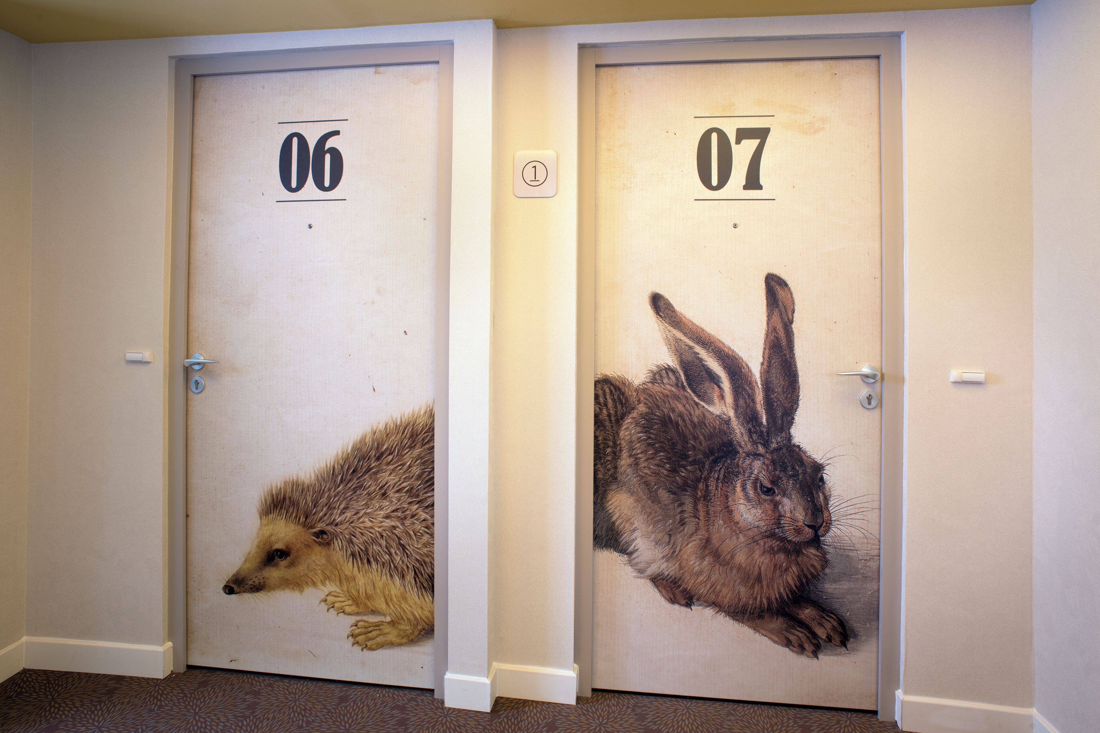 Two doors with animal prints and numbers 06 and 07.
