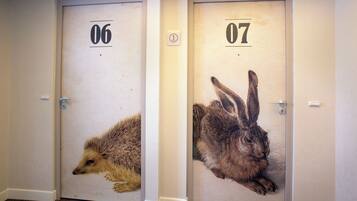 Two doors with animal prints and numbers 06 and 07.