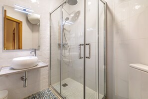 Shower, hair dryer, towels, soap