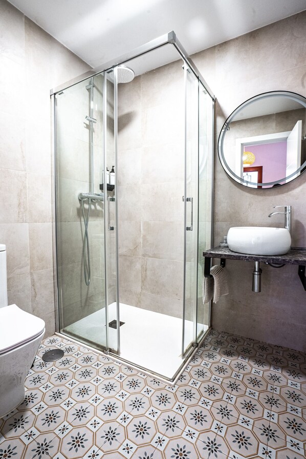 Shower, hair dryer, towels, soap