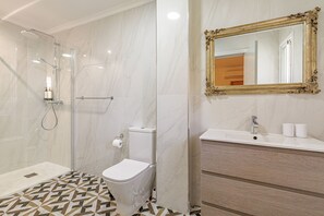 Shower, hair dryer, towels, soap