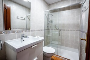 Bathtub, hair dryer, towels, soap