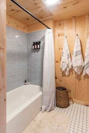 Combined shower/tub, hair dryer, towels, soap