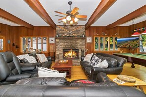 Enjoy the mountain lodge feel with plenty of seating by the fireplace