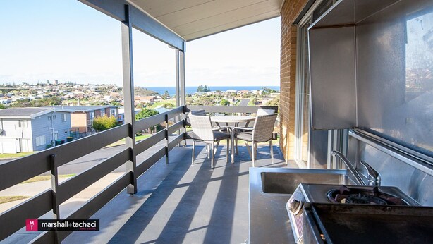 A balcony with a view of a residential area and the sea. - Montaview - Mumbulla St 24 (Bermagui)
