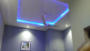 A ceiling with a fan and blue LED lighting. - Joclarif Hotel (Zaria)