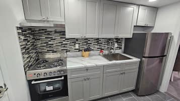 Fridge, microwave, cookware/dishes/utensils