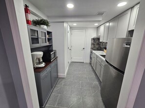 Fridge, microwave, cookware/dishes/utensils