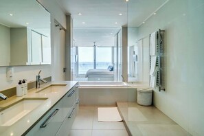 Bathtub, hair dryer, towels