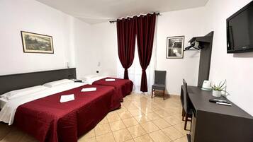Deluxe Quadruple Room, Multiple Beds | In-room safe, soundproofing, free WiFi, bed sheets