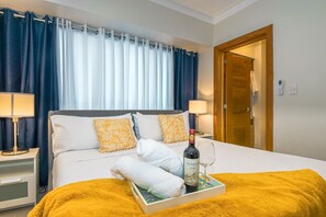 2 chambres, coffre-fort, fer et planche à repasser