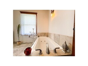Bathtub, jetted bath, hair dryer, towels