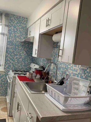 Fridge, microwave, stovetop, coffee/tea maker