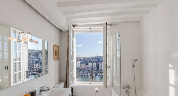 Bathtub, hair dryer, towels