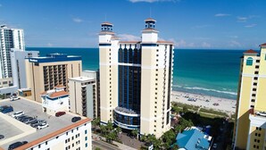 A high-rise hotel with multiple balconies overlooking a beach. - Breakers Tower 1BR Oceanfront Condo (Myrtle Beach)