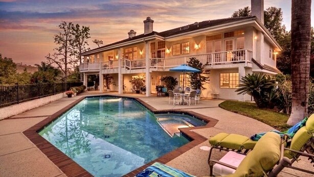 A large, two-story house with a swimming pool, outdoor furniture, and a well-maintained garden. - Custom 3,600sf Fallbrook Retreat: Wedding Guests•Family•Couples-Wine•Golf•Coast (Fallbrook)