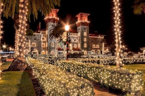 Experience the grandeur of this historic castle, surrounded by beautifully maintained gardens and illuminated pathways.