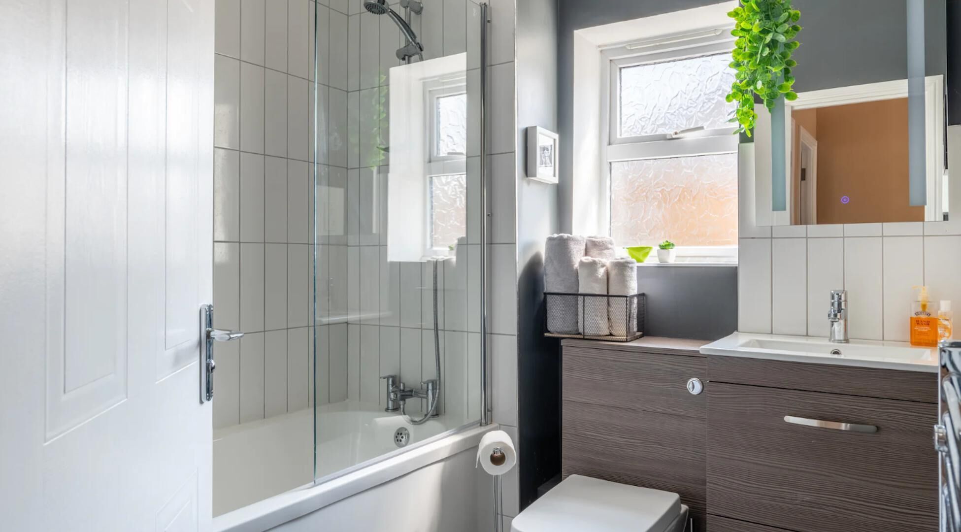Combined shower/bathtub, deep-soaking bathtub, hair dryer, towels