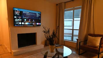Smart TV, fireplace, foosball, books