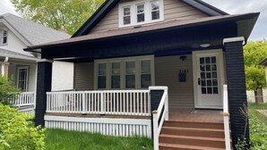 A two-story house with a front porch, a mailbox, and a number 3161 on the door. - Sunny 3BR Craftsman Bungalow | Bay View (Milwaukee)