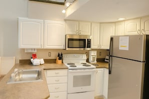 Full-sized fridge, oven, coffee/tea maker, toaster