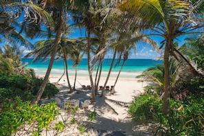 Private beach, white sand, beach towels, beach massages