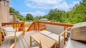 A wooden deck with outdoor furniture, a barbecue grill, and a view of a residential area. - 2 Mi to Dtwn Colorado Springs: Home w/ Large Yard! (Colorado Springs)