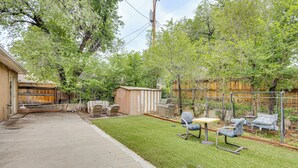 A backyard with a lawn, a wooden shed, a grill, and outdoor furniture. - Family-Friendly Home 2 Mi to Dtwn Colorado Springs (Colorado Springs)
