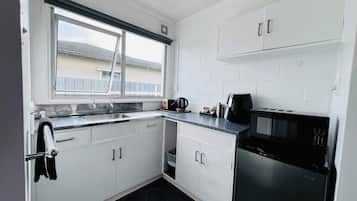 Fridge, microwave, toaster, cookware/dishes/utensils