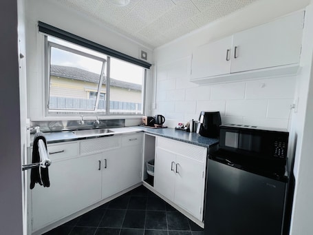 Fridge, microwave, toaster, cookware/dishes/utensils