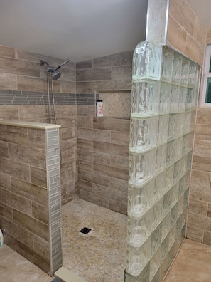 Shower, towels, soap, toilet paper