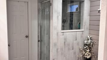 Combined shower/tub, hair dryer, towels, soap