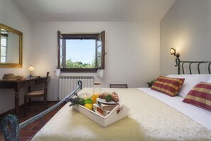 1 bedroom, desk, iron/ironing board, travel crib