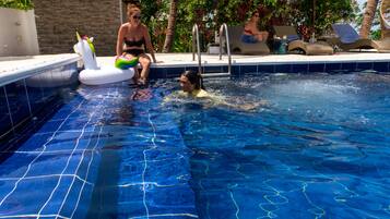 Outdoor pool, pool umbrellas, sun loungers