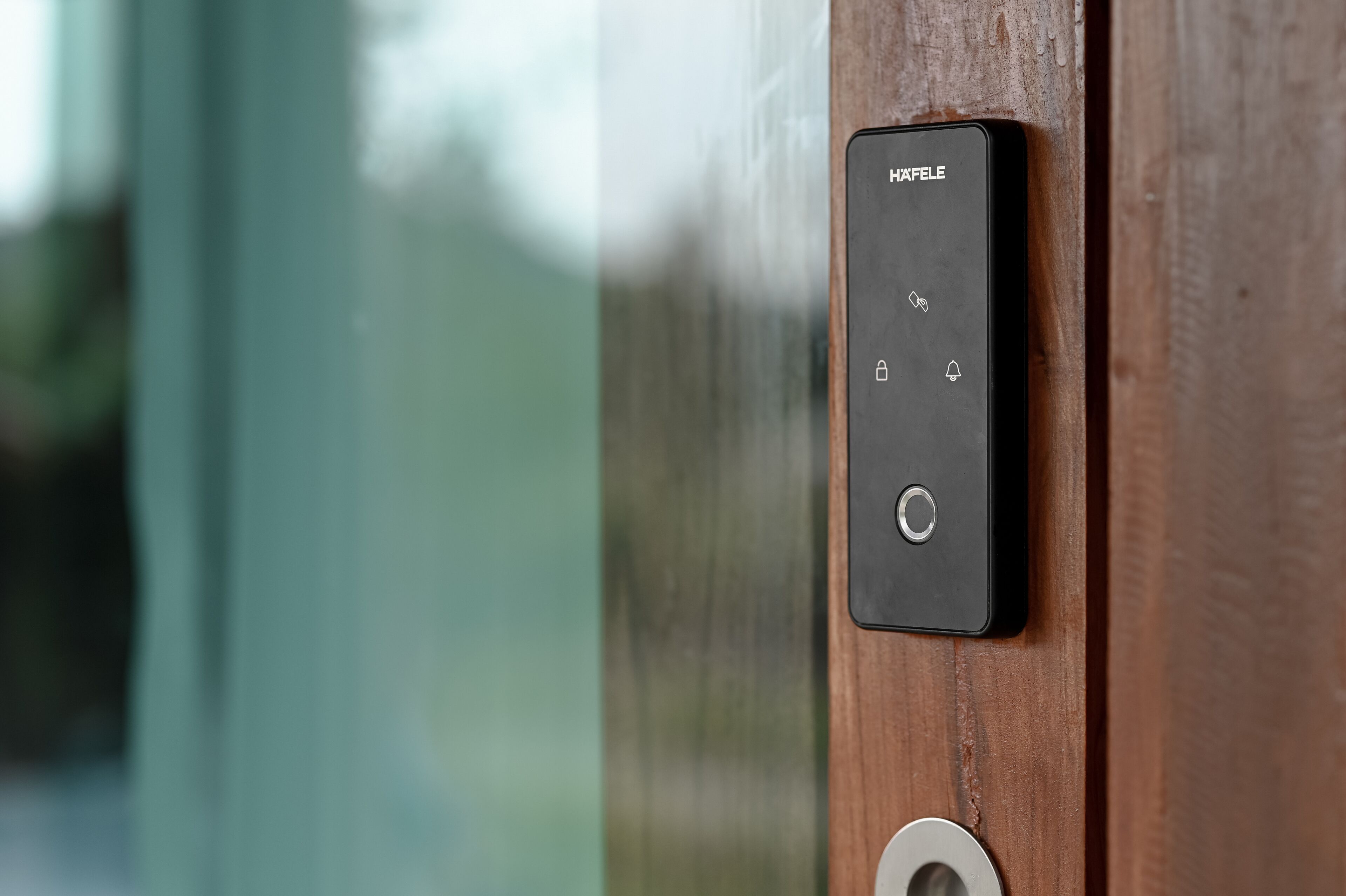 A black control panel with the brand name "HIXFELE" on a wooden door.