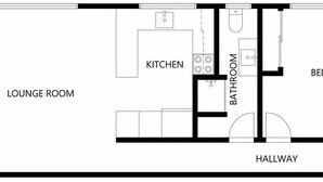 Plano de planta que muestra un balcón, sala de estar, cocina, dos dormitorios, un baño y un pasillo.