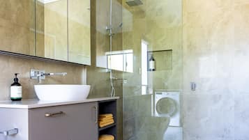 Shower, hair dryer, towels, soap