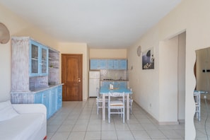 Classic Apartment | Living area | 28-inch flat-screen TV with cable channels, TV