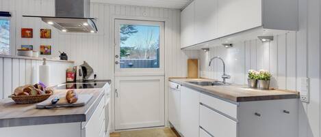 Fridge, stovetop, dishwasher, coffee/tea maker