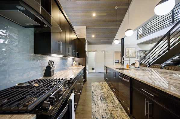 Enjoy cooking in this well-equipped kitchen with a gas stove, oven, and dishwasher.