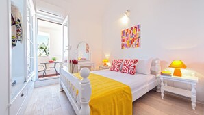 A bedroom with a bed, bedside tables, a mirror, and a window. - 5 Bedroom Villa, Pool, Sea Views, Baska Voda (Baska Voda)